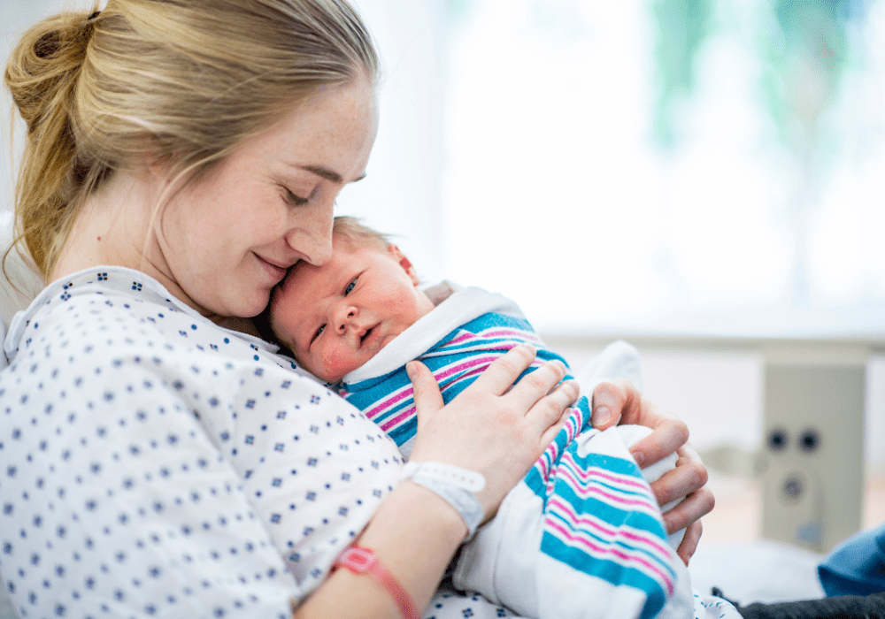 new mom holding her baby. 